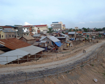 Houses on the banks of a river in Phnom Penh, Cambodia